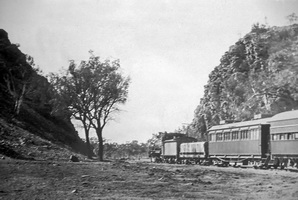 Circa 1930 - Central Australia Railway <em>Ghan</em> -- Heavitree Gap Alice Springs. The car behind the locomotive is the "NRP 24"
