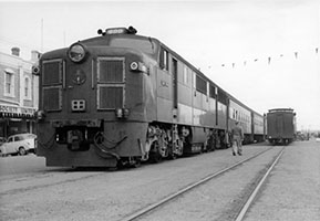 c1962 - Ellen Street - Port Pirie - loco SAR 900 on passenger train in street
