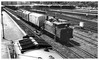 2.1964 - loco SAR F253 + refrigerated van + steel brake + Joint Stock CE class brake being shunted out of platform - Adelaide Station - D Worth Collection